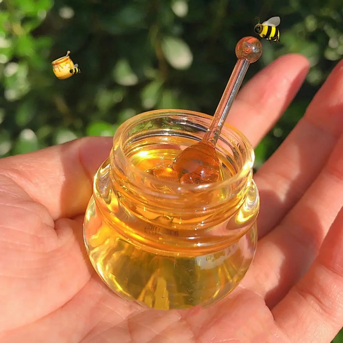 Little honey pot lip mask in a hand, showcasing its nourishing moisturizing properties for healthy lips.